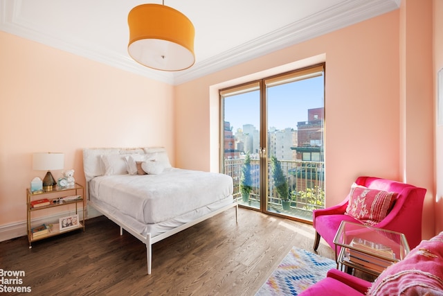 bedroom featuring crown molding, dark hardwood / wood-style flooring, and access to outside