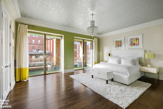 bedroom with dark hardwood / wood-style flooring, access to exterior, ornamental molding, and a textured ceiling