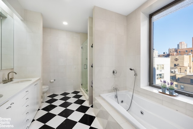 full bathroom featuring a healthy amount of sunlight, toilet, tile walls, and plus walk in shower