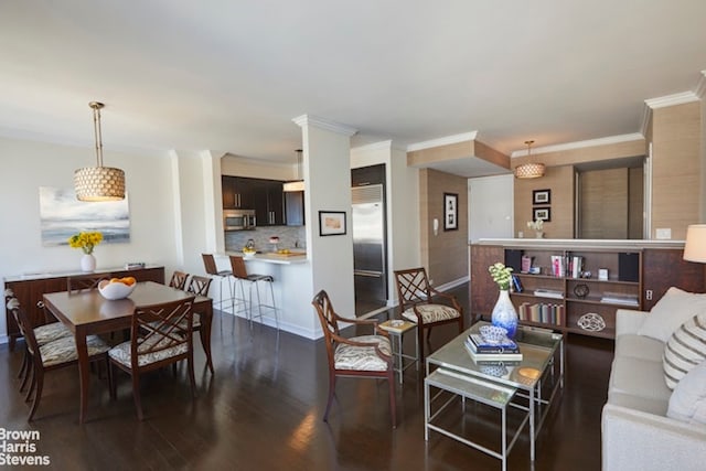 living room featuring dark wood-type flooring and ornamental molding