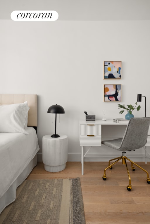 bedroom with wood-type flooring