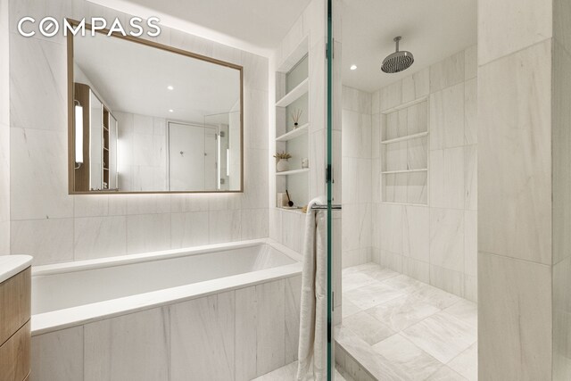 250 W 96th St Unit 9C, New York City, NY 10025 - bathroom with vanity, tile walls, and tiled shower