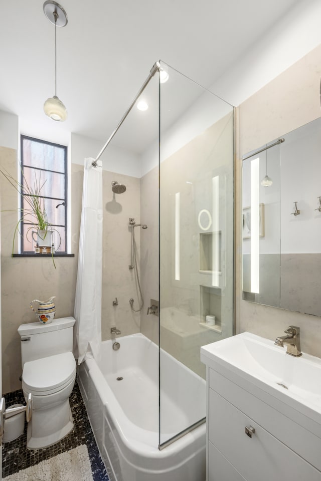 full bathroom with shower / tub combo, toilet, and vanity