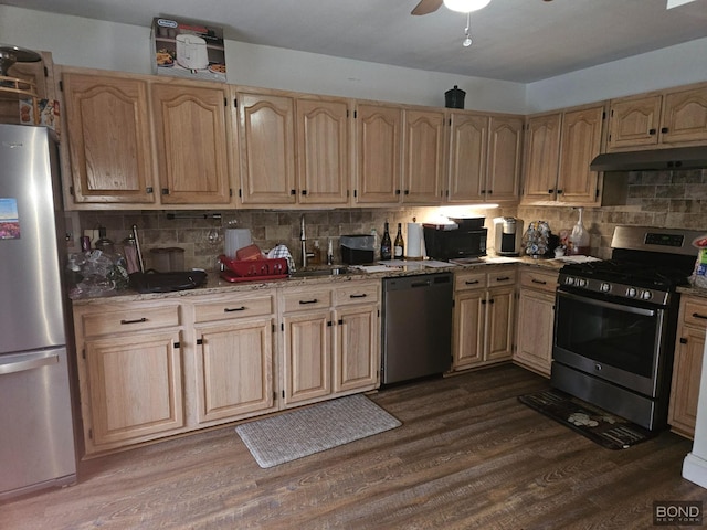 717 Annadale Rd, New York City, NY 10312 - kitchen featuring stainless steel appliances, under cabinet range hood, light brown cabinets, and decorative backsplash