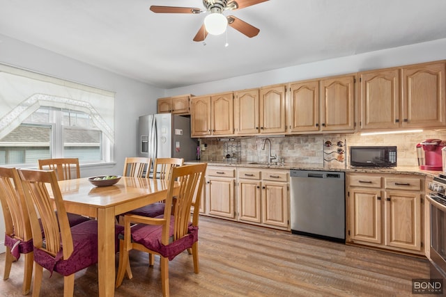 717 Annadale Rd, New York City, NY 10312 - kitchen with stainless steel appliances, a sink, and light brown cabinets