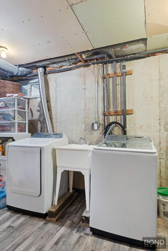 717 Annadale Rd, New York City, NY 10312 - laundry area featuring independent washer and dryer and wood finished floors