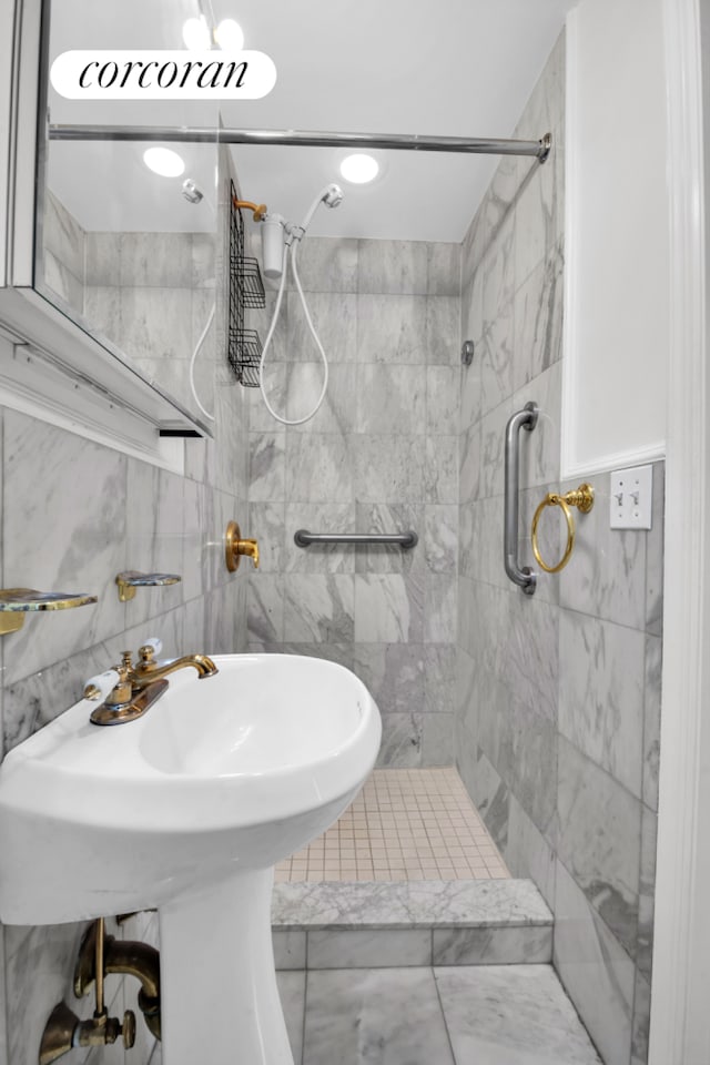 bathroom with a tile shower