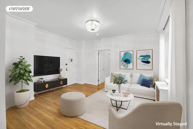 living room featuring hardwood / wood-style flooring and crown molding