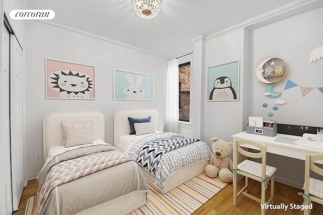 bedroom featuring visible vents and wood finished floors