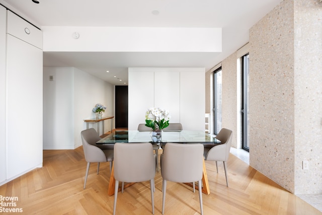 dining area featuring light parquet flooring