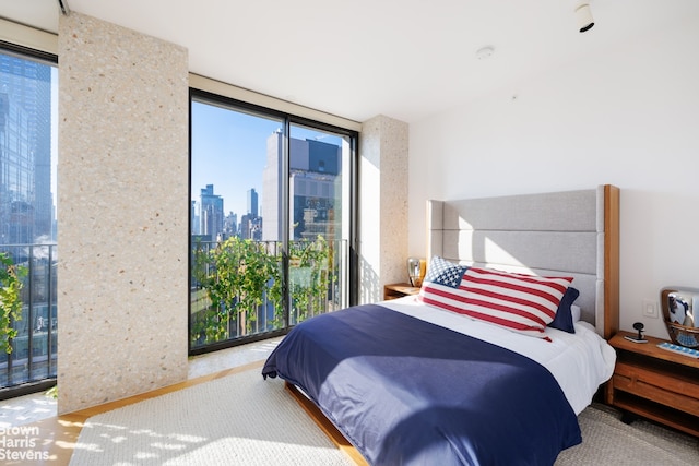 bedroom with floor to ceiling windows