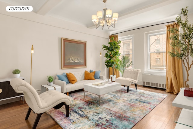 living area featuring beam ceiling, visible vents, radiator heating unit, an inviting chandelier, and wood finished floors