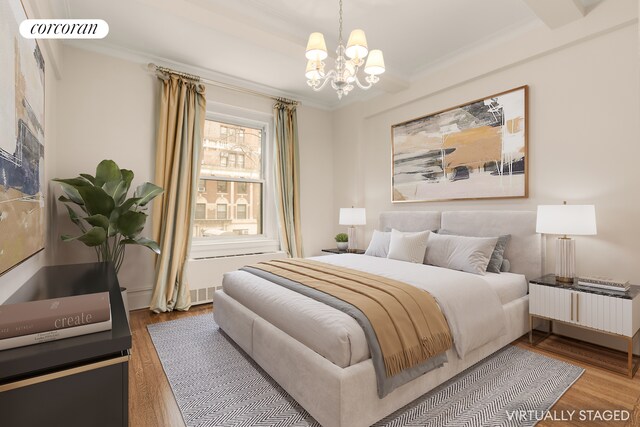 bedroom featuring a notable chandelier, crown molding, and wood finished floors