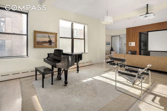 interior space featuring light wood-style flooring and a baseboard heating unit