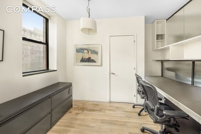 home office featuring light wood-style floors