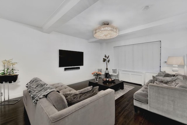 living area featuring dark wood-type flooring, beamed ceiling, and baseboards