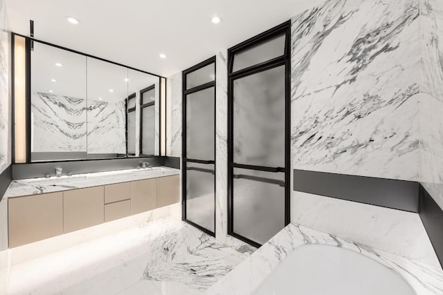 bathroom with vanity and a bathing tub