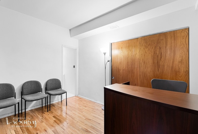 office area with light hardwood / wood-style floors