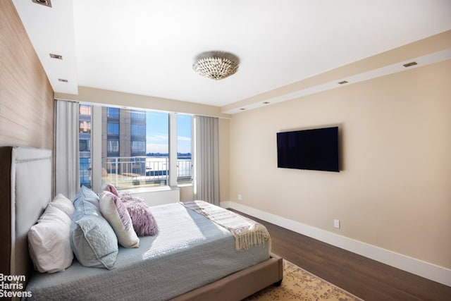 bedroom featuring wood-type flooring