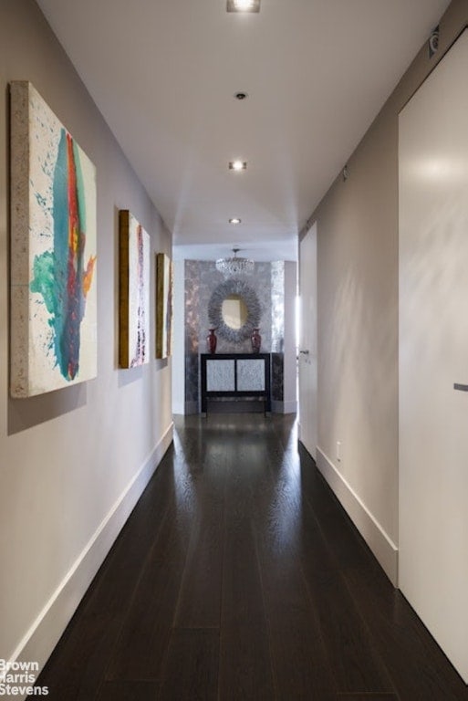 hall with dark hardwood / wood-style floors