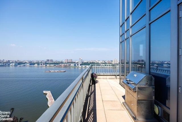 balcony featuring a water view