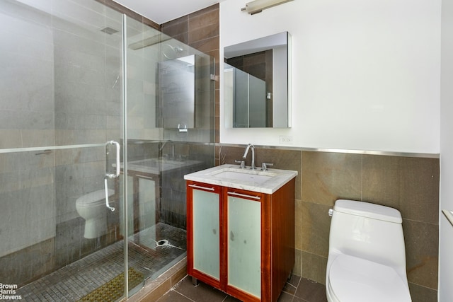 3585 Greystone Ave Unit 3De, New York City, NY 10463 - full bathroom featuring toilet, tile walls, vanity, a shower stall, and tile patterned flooring