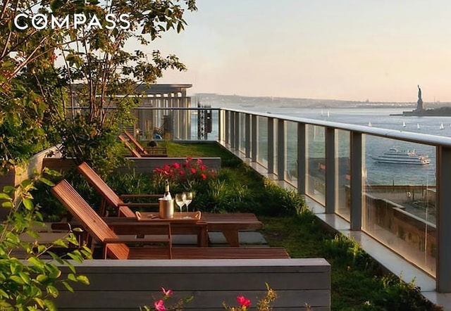 view of balcony at dusk