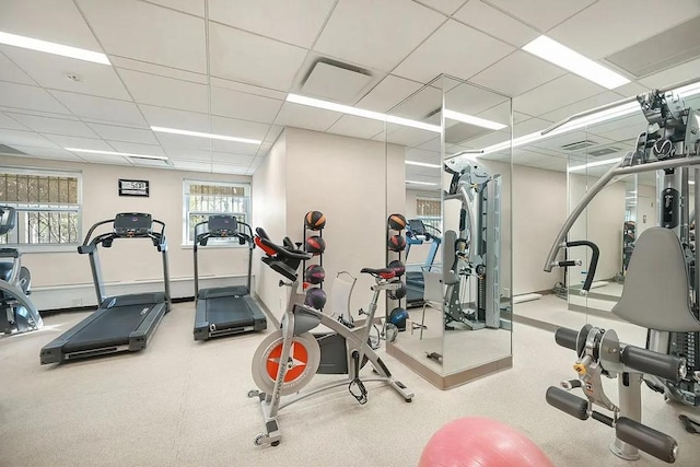 workout area featuring a paneled ceiling