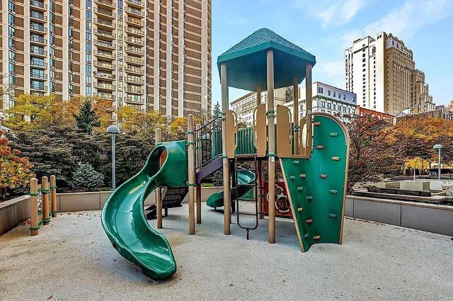 community jungle gym with a view of city