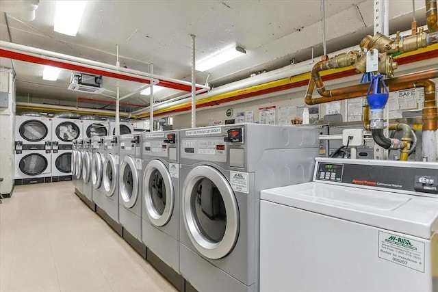 laundry room featuring stacked washer and clothes dryer and independent washer and dryer