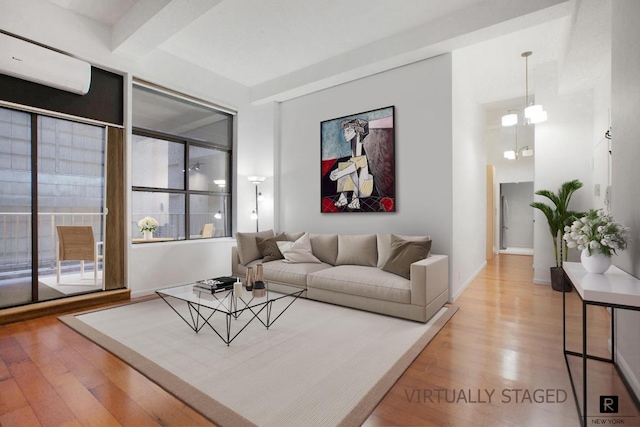 living room with beam ceiling and wood-type flooring