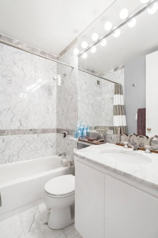 full bathroom featuring vanity, tile walls, toilet, and shower / bath combination with curtain