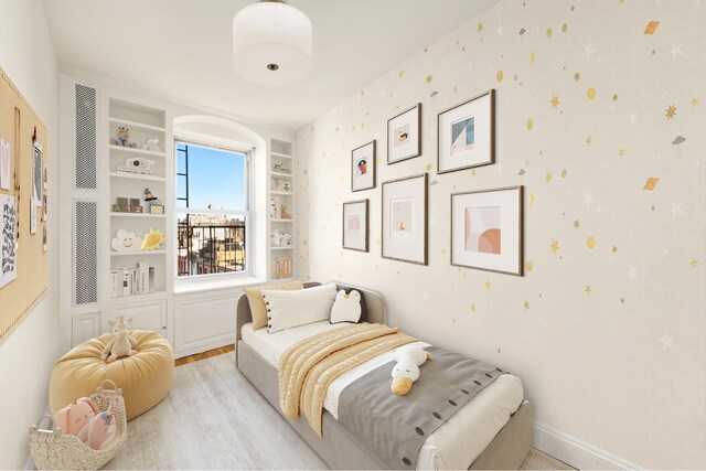 bedroom with light wood-type flooring