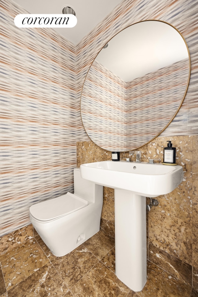 100 United Nations Plz Unit 7G, New York City, NY 10017 - bathroom featuring tile walls and toilet