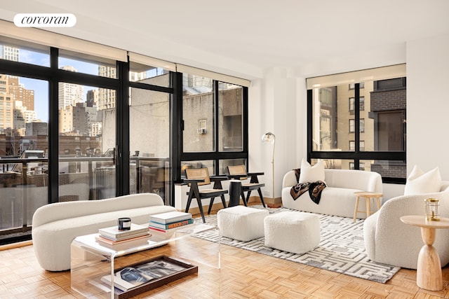 living area with a view of city and visible vents