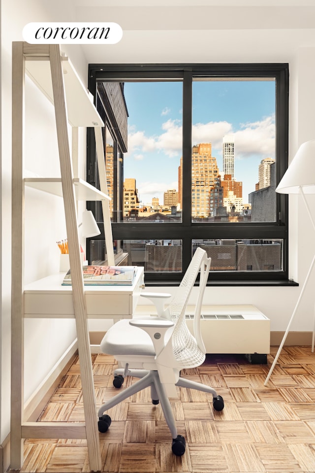 100 United Nations Plz Unit 7G, New York City, NY 10017 - home office featuring a view of city, healthy amount of natural light, and baseboards