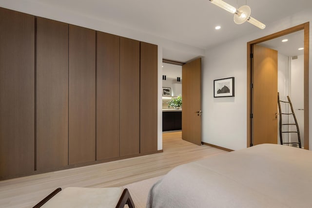 bedroom featuring recessed lighting and light wood-style flooring