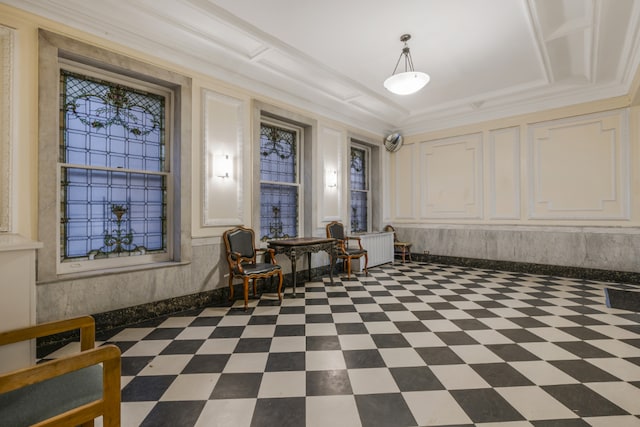 interior space featuring crown molding and a raised ceiling