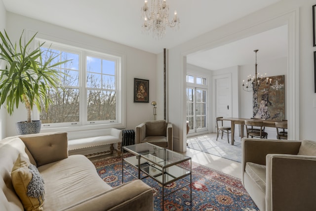 living room featuring a notable chandelier