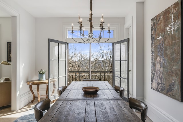 dining space with an inviting chandelier