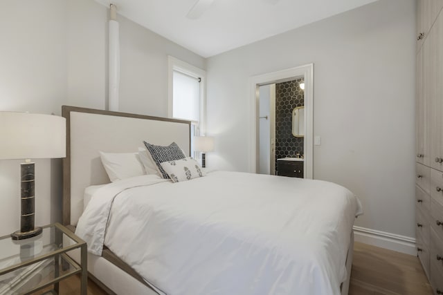 bedroom with hardwood / wood-style floors and ceiling fan