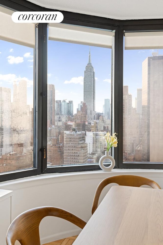 330 E 38th St Unit 27A, New York City, NY 10016 - dining room featuring a view of skyline and healthy amount of natural light