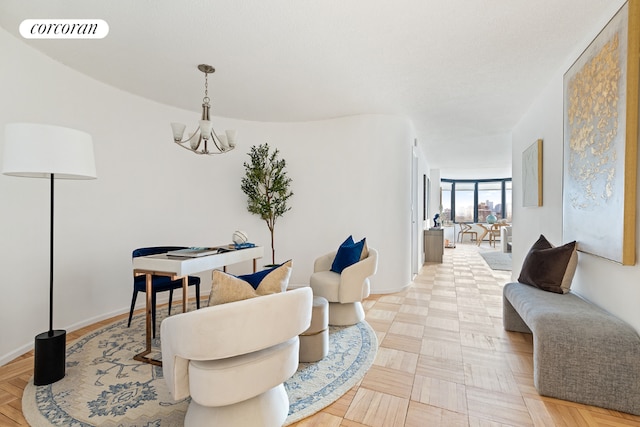 living area featuring a chandelier and light parquet floors