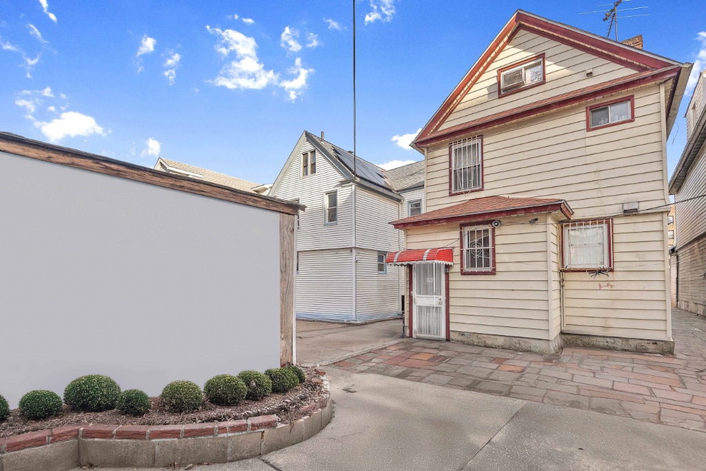 rear view of house with a patio