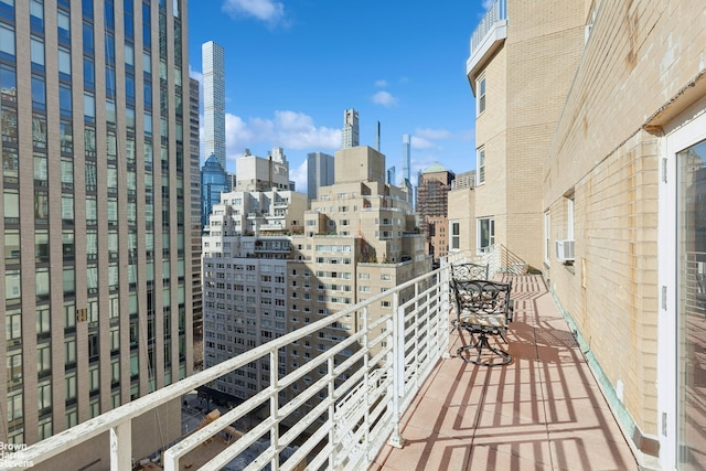 205 E 63rd St Unit 18C, New York City, NY 10065 - balcony featuring a view of skyline and cooling unit