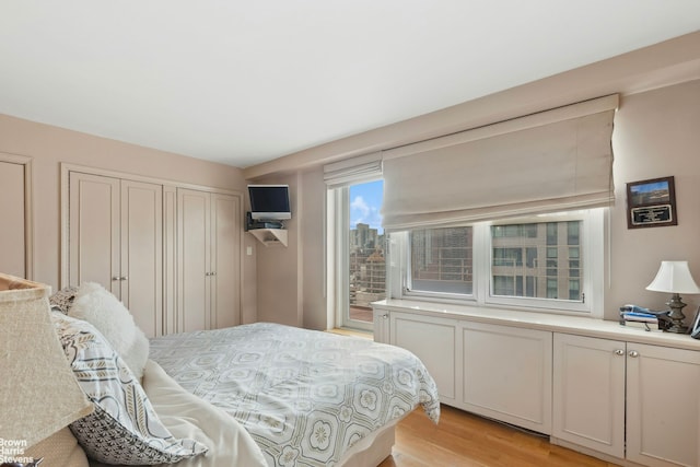 bedroom with light wood-style flooring