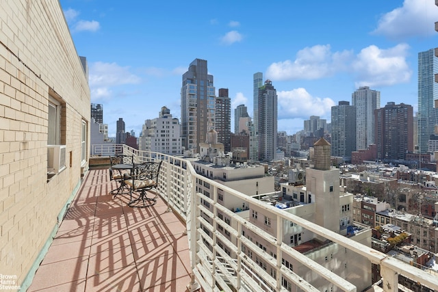 balcony with a city view and cooling unit