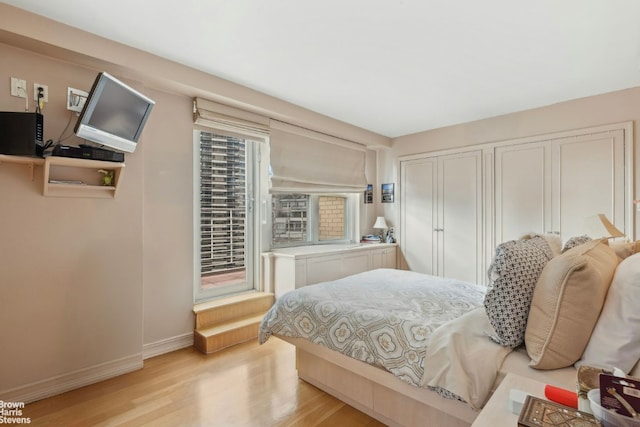 bedroom with light wood-type flooring