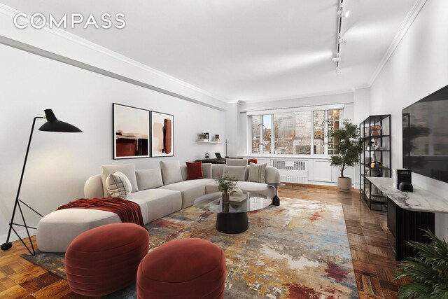 living room with crown molding, track lighting, a notable chandelier, and dark parquet floors