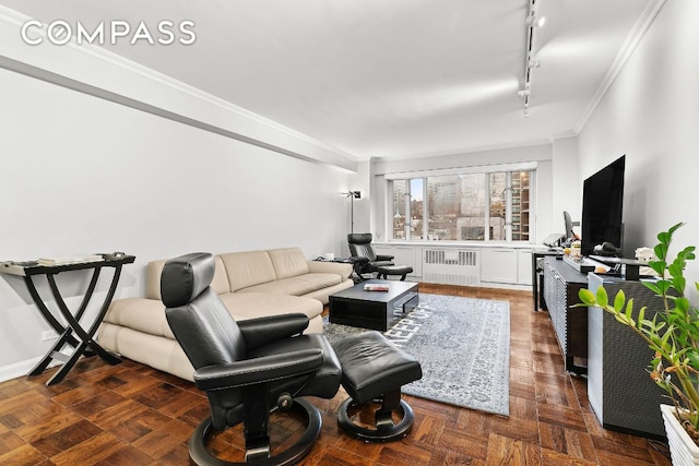 living room with crown molding, radiator heating unit, rail lighting, and dark parquet floors